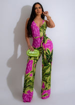 Beautiful emerald green jumpsuit with leaf pattern, perfect for outdoor activities and nature enthusiasts