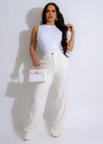 White high-waisted pants with flared legs, perfect for a summer outing