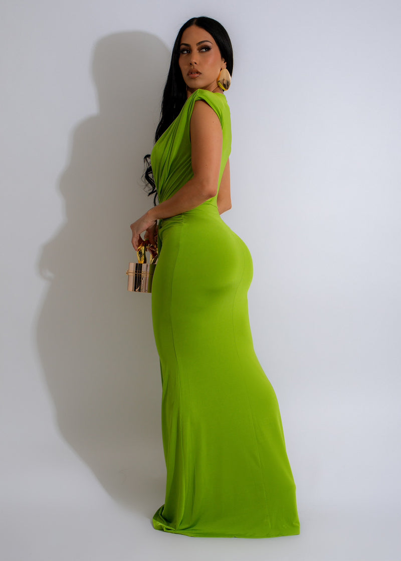  Close-up shot of the Day To Day Maxi Dress Green, showcasing its vibrant green color, soft fabric, and elegant silhouette, ideal for various occasions and seasons
