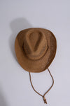 High-quality tan cowboy hat with a classic Western design and adjustable chin strap