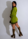  Elevate your wardrobe with the Bitter Sweet Sweater Mini Dress Green, a versatile and chic knit dress perfect for layering and accessorizing in colder temperatures
