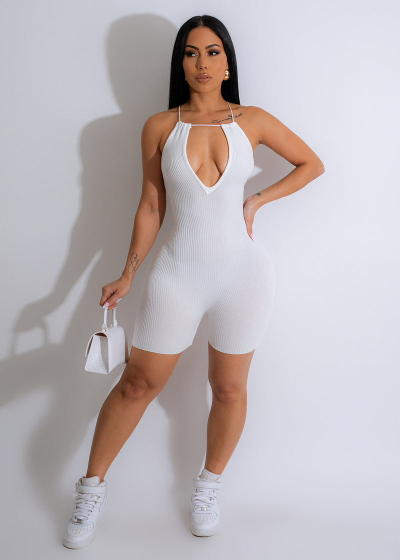 Front view of the white ribbed romper with V-neck and adjustable straps 