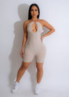 Close-up of nude ribbed romper with spaghetti straps and V-neckline