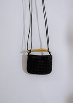 Chic and elegant black handbag with spacious interior and versatile style