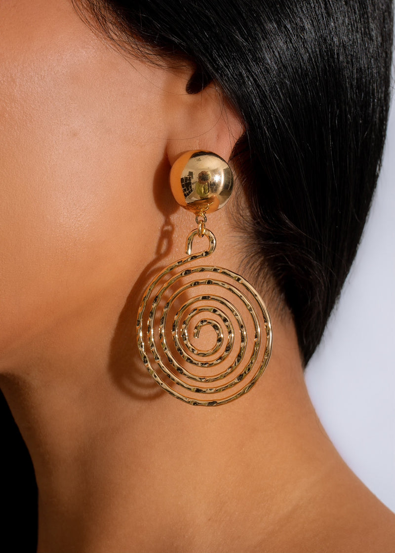 Shimmering gold earrings with delicate fire-inspired design, perfect for a glamorous night out or special occasion