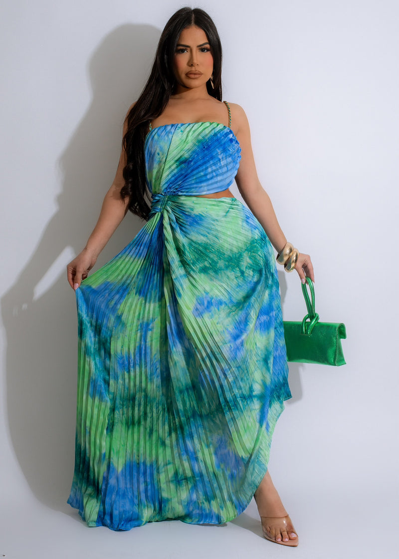 Celestial Love Pleated Maxi Dress Blue, a stunning floor-length dress with celestial-inspired print and pleated details in a beautiful shade of blue, perfect for any special occasion or event