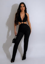 Lace jumpsuit in black with intricate floral pattern and flattering silhouette