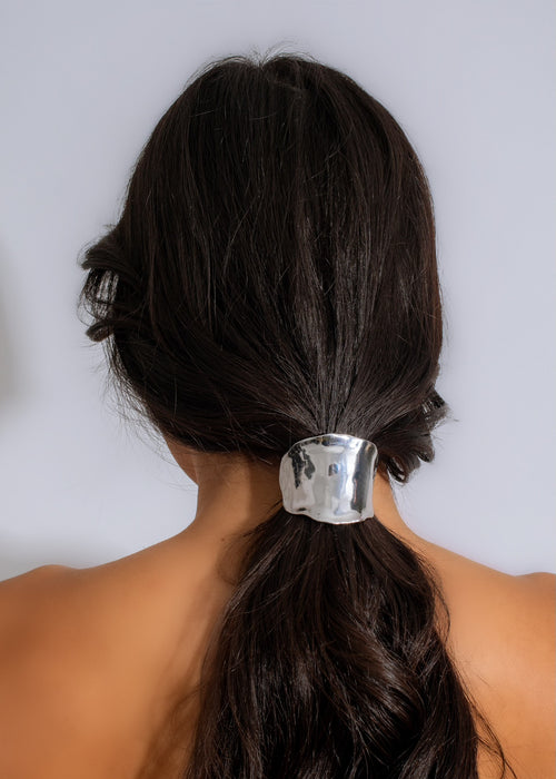 Silver hair tie with elegant design, perfect for classy hairstyles