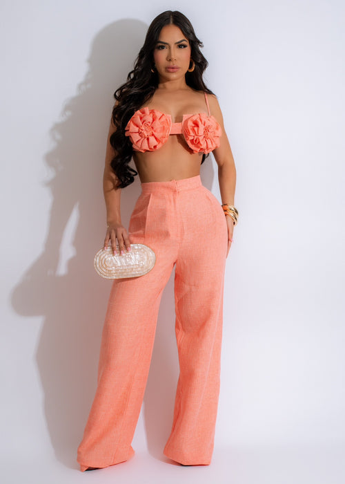 Close-up image of the Touch Of Romance Tweed Pant Set Orange, featuring a high-waisted, wide-leg pant and a matching cropped tweed blazer in a vibrant orange color, perfect for adding a touch of sophistication and romance to any outfit