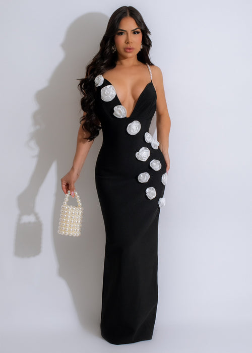 Elegant black maxi dress with pearl embellishments and bandage detailing