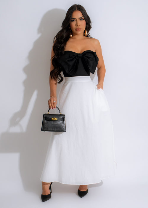Under The Bow Maxi Dress White - Front view of elegant dress with adjustable bow detail and flowing silhouette 