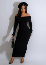Close-up view of elegant black knitted midi dress with intricate lace details and a flattering silhouette, perfect for a romantic evening or special occasion