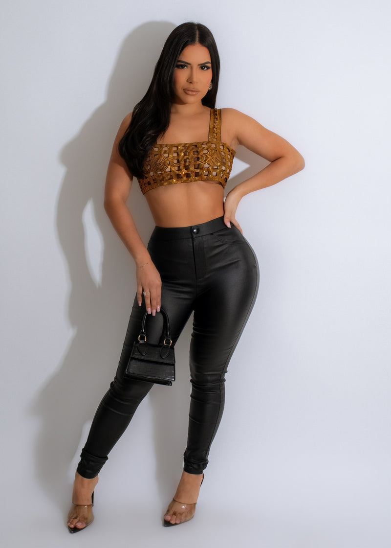 Shimmering gold crop top with diamond detailing, perfect for evening wear