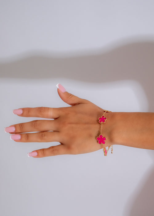Handcrafted pink beaded bracelet with delicate gold accents and adjustable clasp