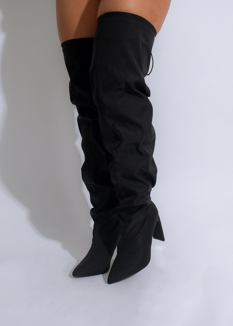 Black leather high knee boots with lace-up front and chunky heel