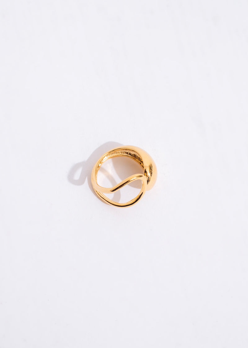  A close-up shot of a woman's hand wearing the Got Me Feeling Ring with the sapphire catching the light