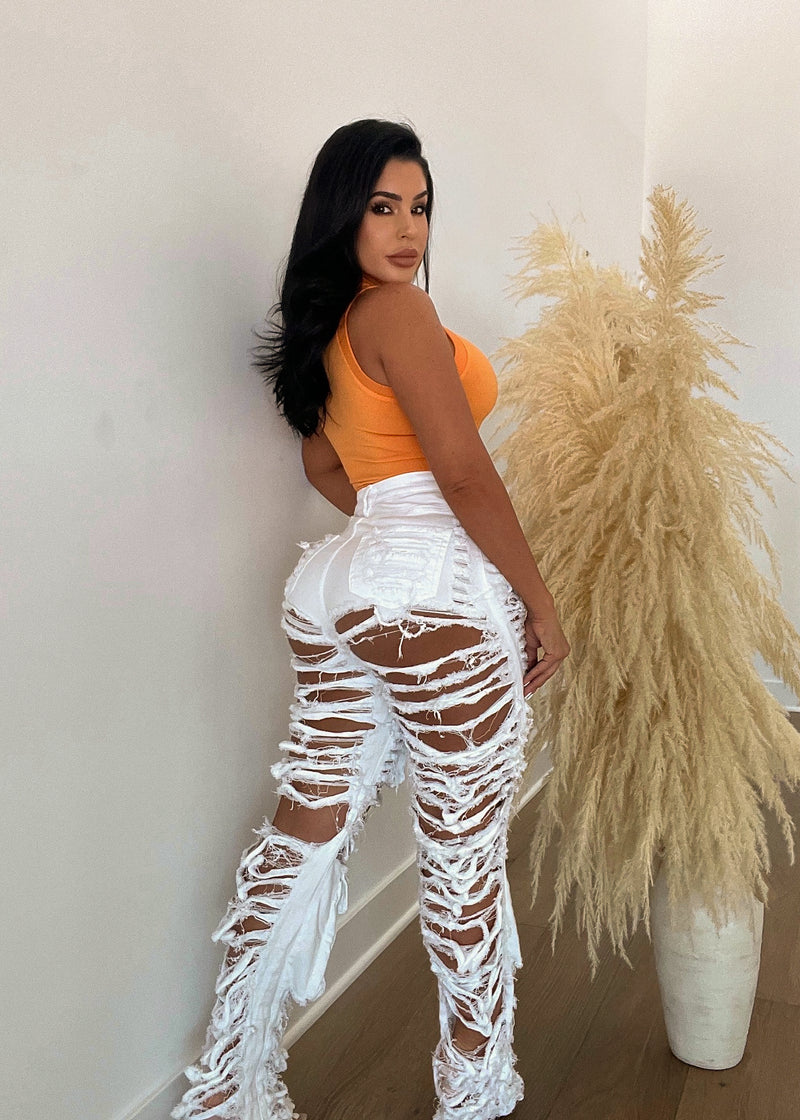  Side view of Get Lucky Ripped Jeans White showing the ripped and shredded design