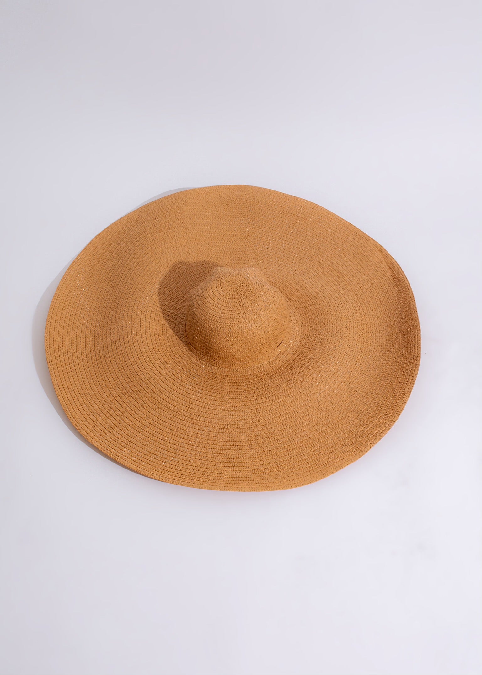 Close-up of the Adventures In The Sand Hat Brown, featuring a wide brim and intricate woven design, perfect for outdoor adventures