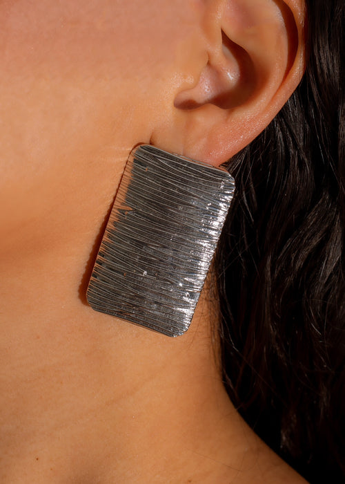 Shiny silver earring with a heart-shaped pendant, perfect for expressing love and affection in style