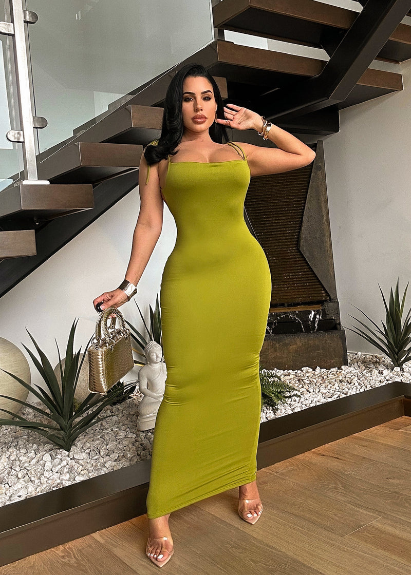Gorgeous green cocktail dress featuring a stylish ruched design and flowy skirt