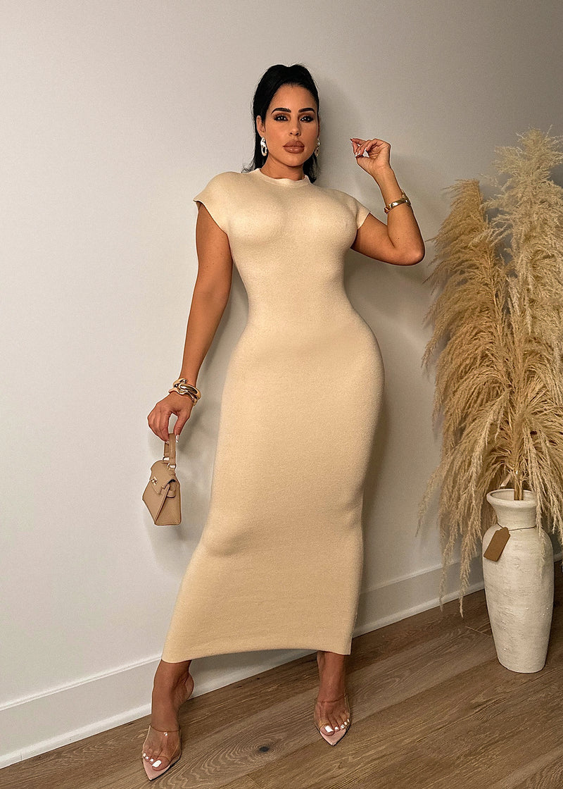 Close-up of the cozy, nude Miss The Moment Sweater Midi Dress with ribbed detailing and long sleeves, perfect for chilly days and casual outings 