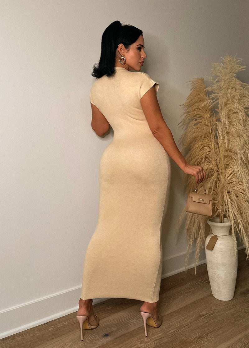  Full-length image of the Miss The Moment Sweater Midi Dress in a flattering nude shade, featuring a relaxed fit, round neckline, and a stylish midi length