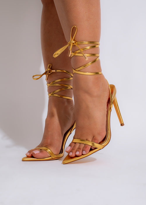  Stylish and glamorous gold high heels with metallic finish and pointed toe