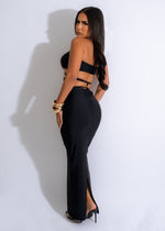 Matching crop top and high-waisted skirt set in elegant black with pearl embellishments