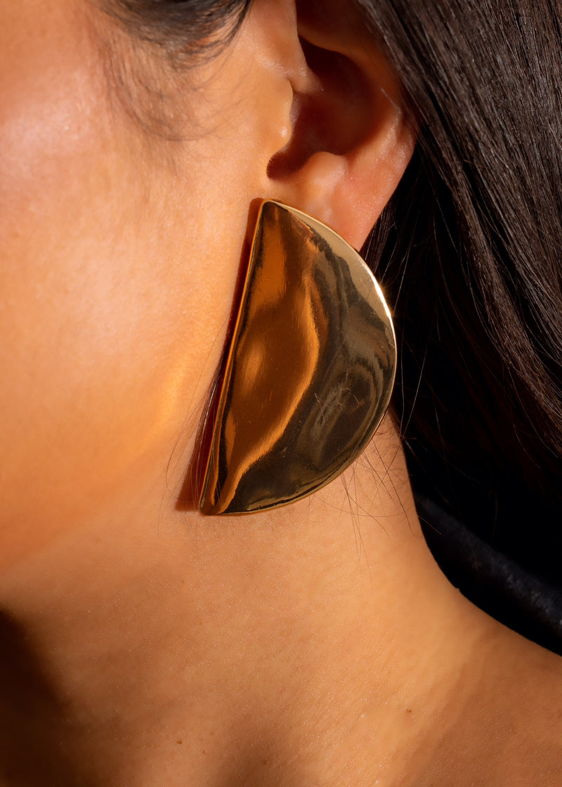 Shiny gold earrings with intricate design, perfect for adding a touch of luck to your outfit