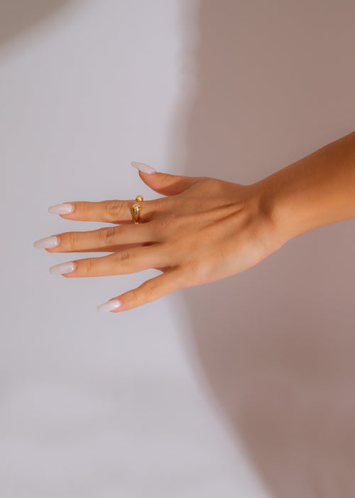 A close-up image of the elegant Committed To Me Ring featuring a stunning design with intricate details and sparkling gemstones