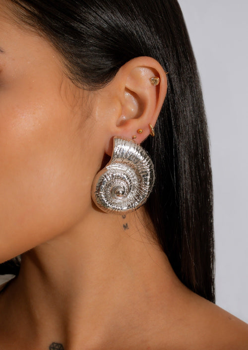 Beautiful silver earrings with ocean-inspired design, perfect for a beach getaway