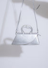  A close-up image of the My Decision Handbag Silver, showcasing its intricate stitching and high-quality craftsmanship