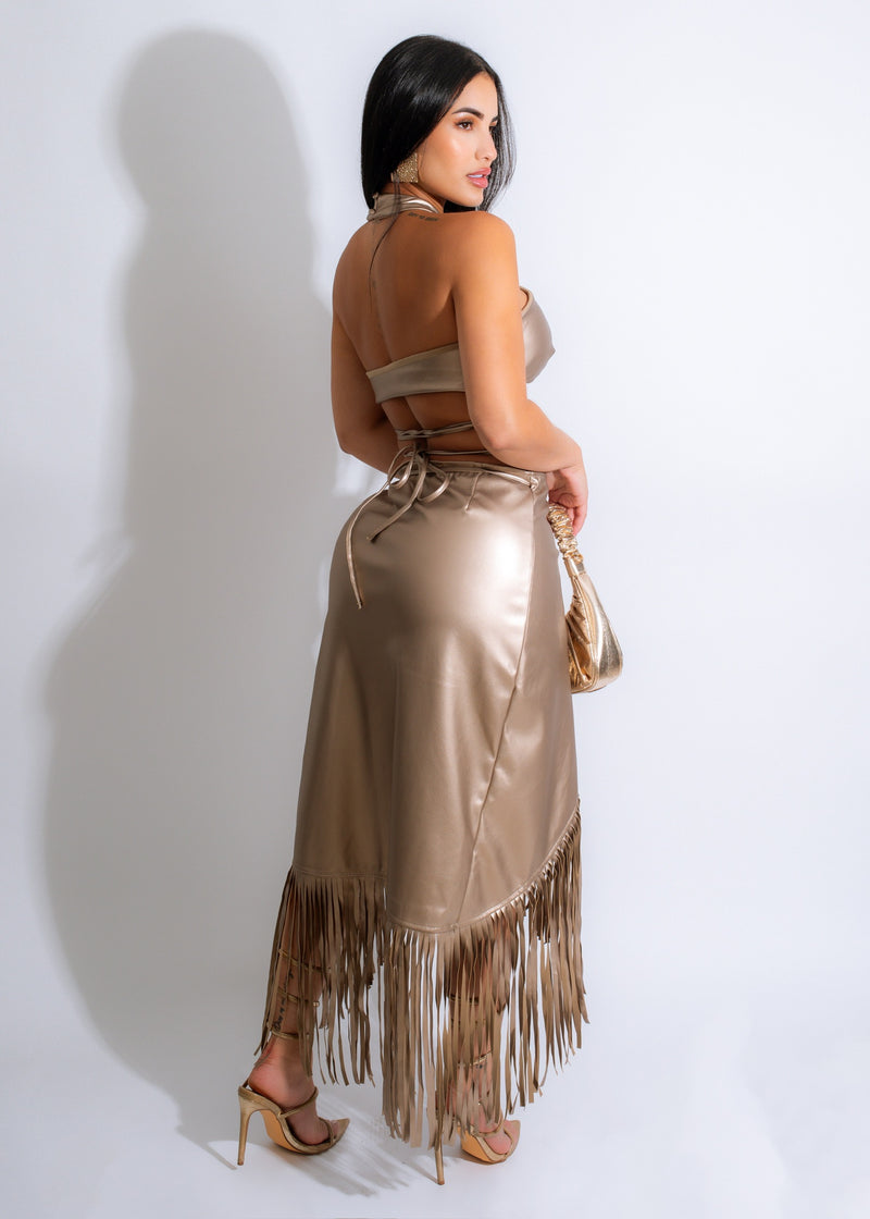Gold faux leather skirt set with fringe detailing for impactful style