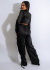 Black silk cargo pant set with matching top and intricate detailing