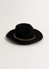 Black hat with embroidered 'Make No Promises' text, perfect for casual wear