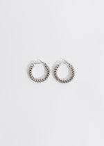 Shiny silver earrings with intricate design and attention-grabbing appeal