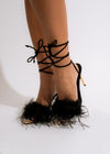  Elegant black heel with glossy finish and slim stiletto heel