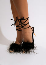  Elegant black heel with glossy finish and slim stiletto heel