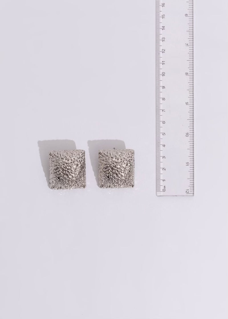  Elegant silver earrings featuring a stunning cityscape motif, ideal for a night out in the city