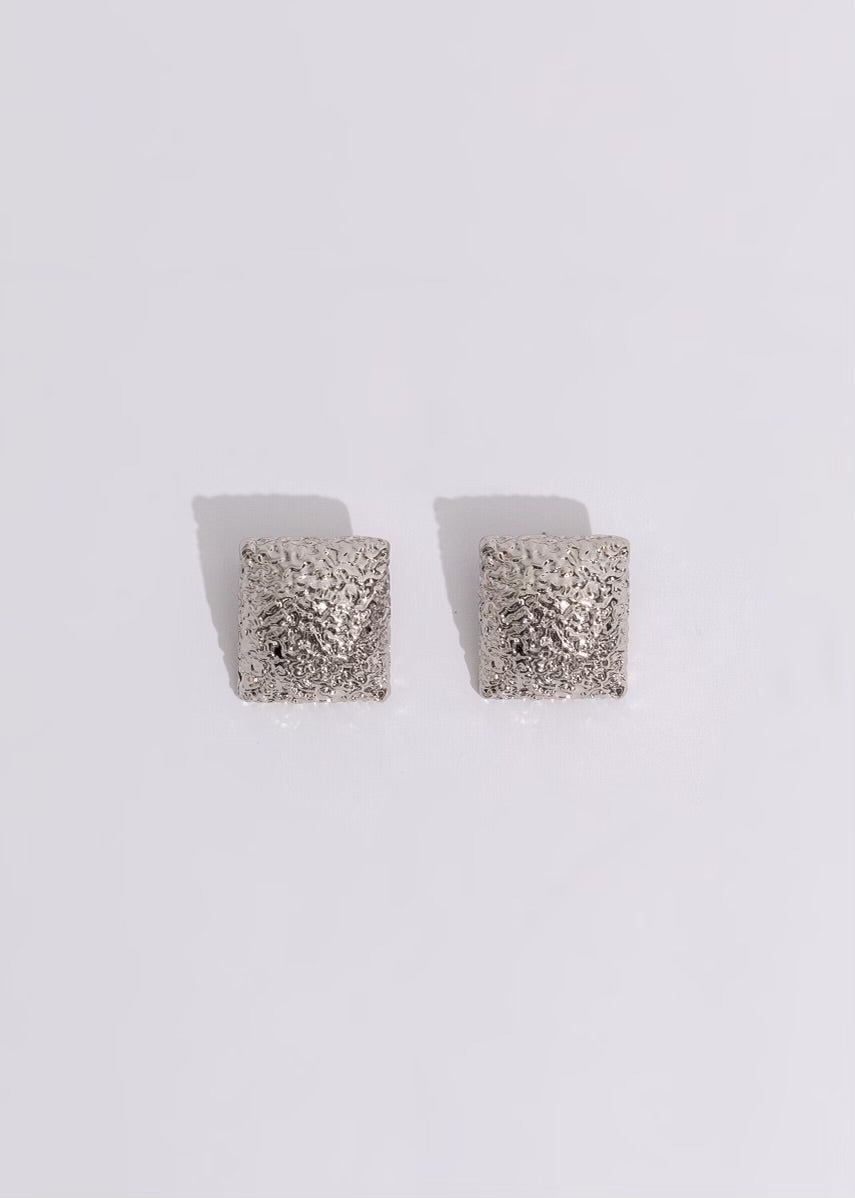 Dazzling silver earrings with intricate city skyline design, perfect for evening events