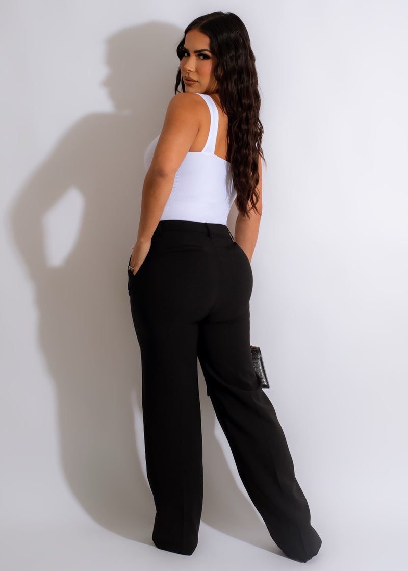 A photo of a woman wearing the Drunk In Love Pant Black, a stylish and comfortable garment perfect for a night out or a casual day