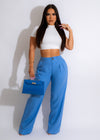 A woman wearing Decision To Leave Linen Pant Blue for a casual summer look