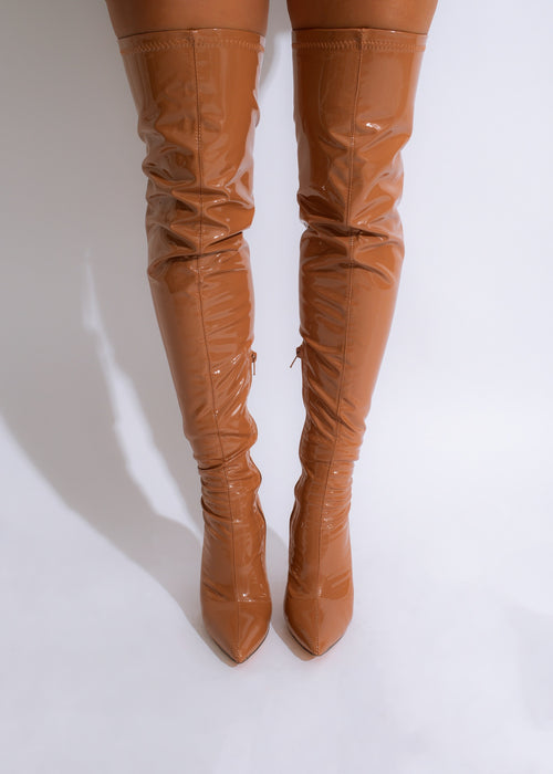 Savage Latex Knee High Boots Brown, a stylish and edgy footwear choice for fashion-forward individuals looking to make a statement