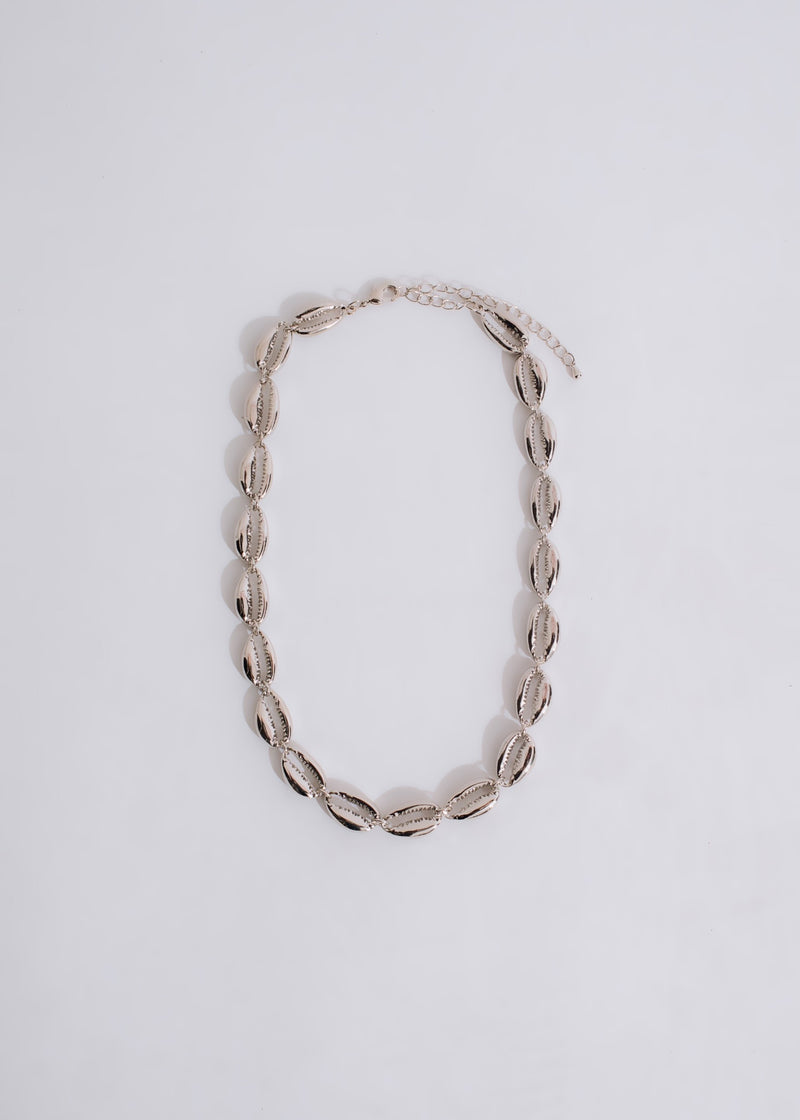 Beautiful silver necklace featuring intricate sea creatures and sparkling blue gemstones