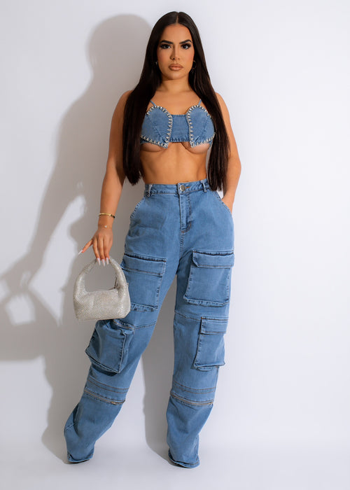 Close-up of blue denim crop top with rhinestone heart design and silver studs