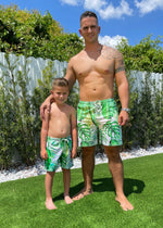 Two young boys playing on the beach wearing comfortable and stylish Summer In The Air Boys Shorts 