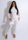Stunning white jumpsuit with plunging neckline and flared legs for a glamorous night out