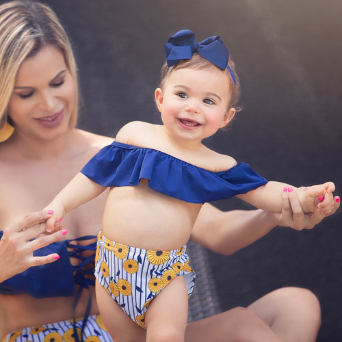 Adorable sunflower baby swimsuit with colorful floral pattern for children